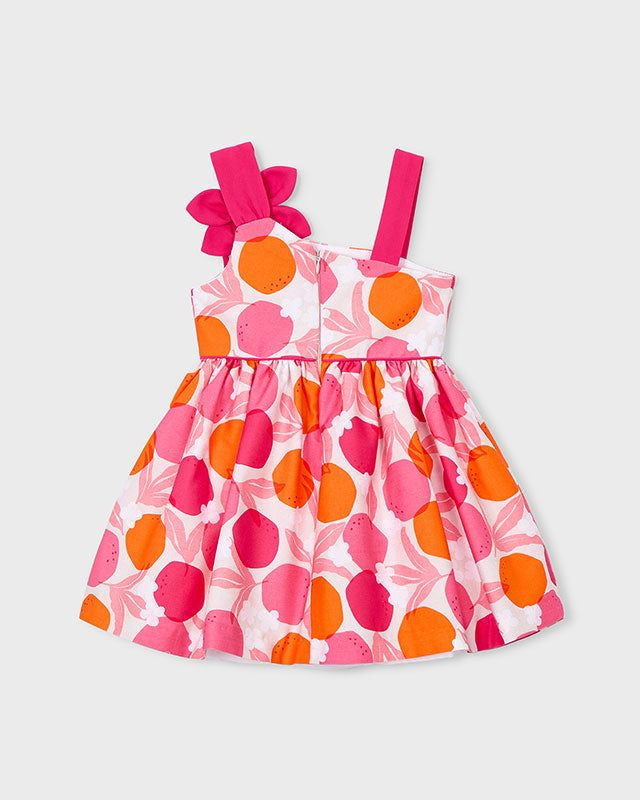 Dettaglio del vestito cerimonia bambina Mayoral con fiocco rosa e stampa a pallini