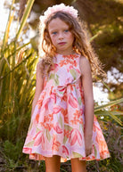 Abito cerimonia bambina con fiori rosa e arancio, look romantico e leggero