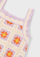 Dettaglio tessuto abito bambina maglia crochet lilla