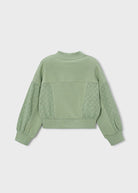 Retro della felpa bambina verde traforata